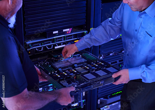 Two men working in data center
