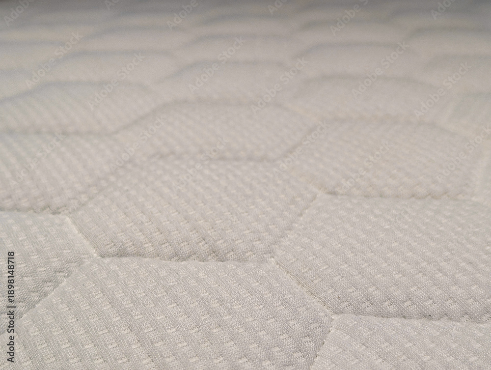 Obraz premium White orthopedic mattress texture with a honeycomb quilted pattern