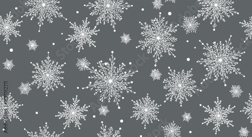 Detailed white snowflake pattern on a dark grey background featuring diverse crystalline structures for a sophisticated winter design theme.