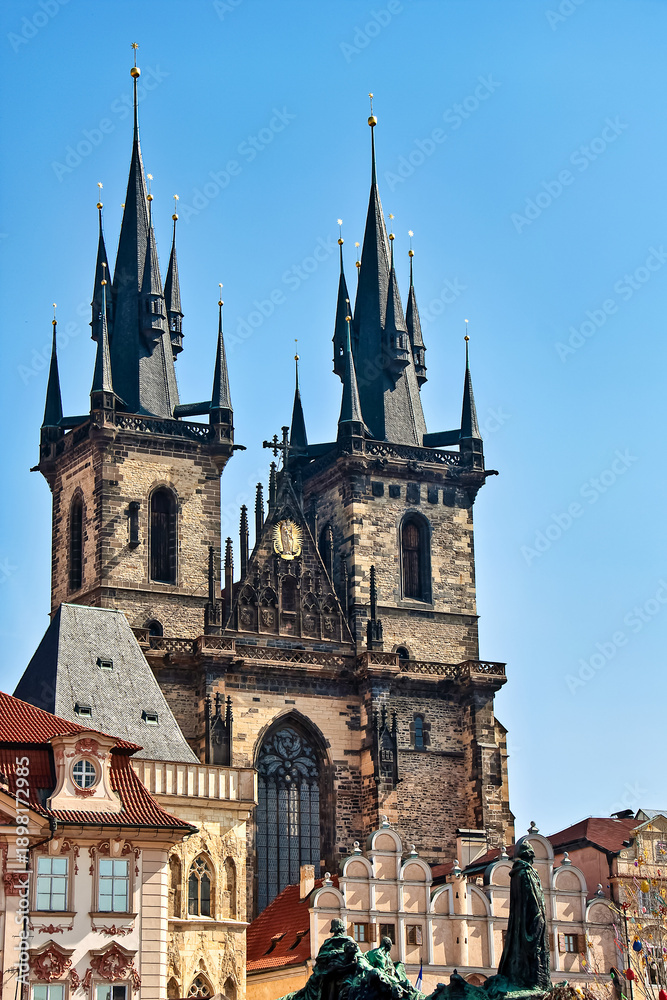 Fototapeta premium Religious monument Marian Column and Teyn church located in the old town square of Prague, Czech Republic