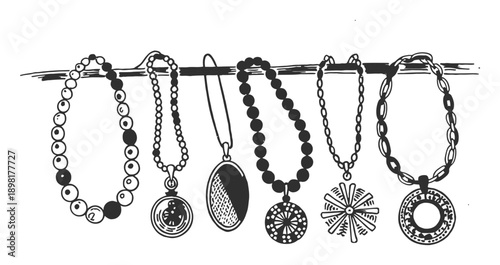Collection of diverse necklaces with pendants hanging on a line