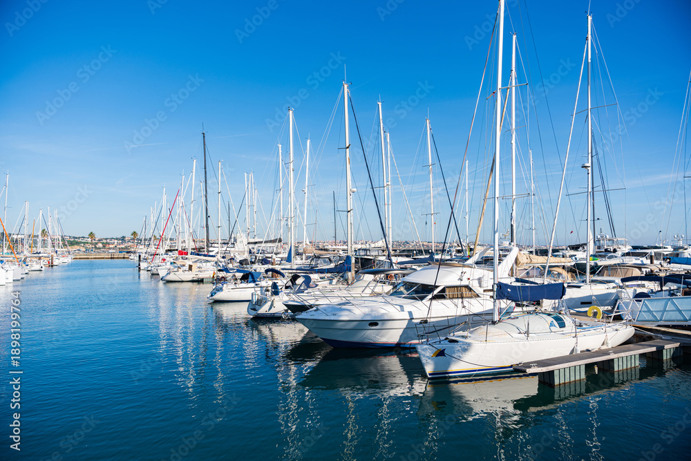 Obraz premium Plenty of white yachts docking at marina, Cascais, Portugal