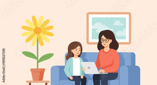 Two people on a couch with a flower and framed art in a room