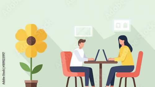 Two people work on laptops at a table with a flower nearby