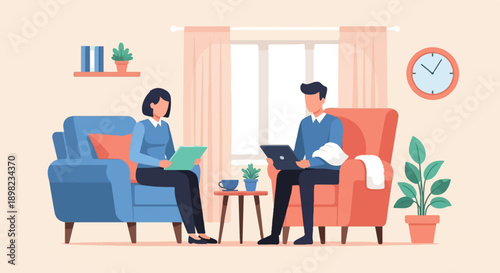 Two people sitting in armchairs, engaged in conversation and work indoors