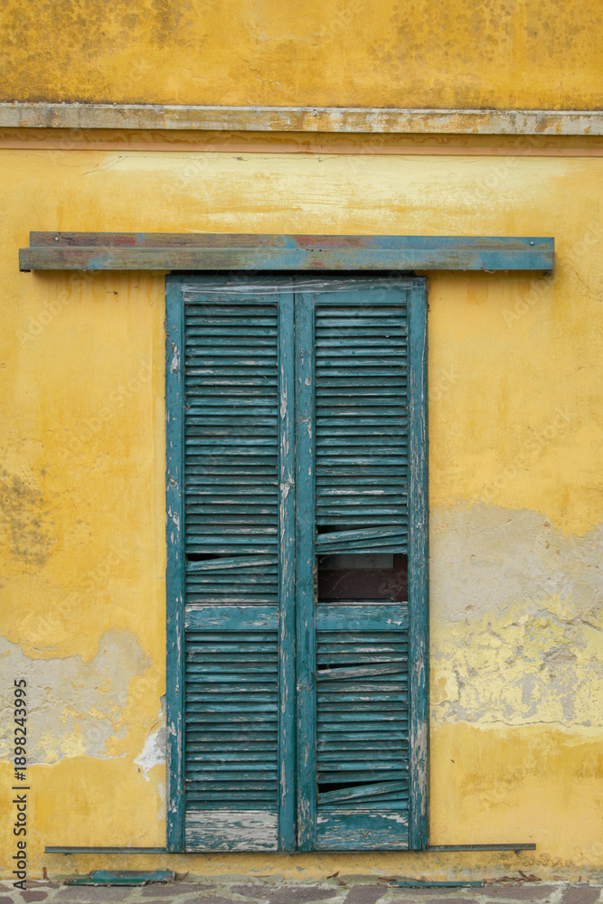 Fototapeta premium Old windows of a country house of Oltrepo Pavese, hilly area of Northern Italy (Lombardy Region, Pavia Province) famous for red, white and sparkling wine production.