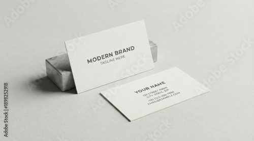 Minimalist business card mockup with modern branding,featuring front and back clean layout on neutral background for corporate identity or personal contact design preview