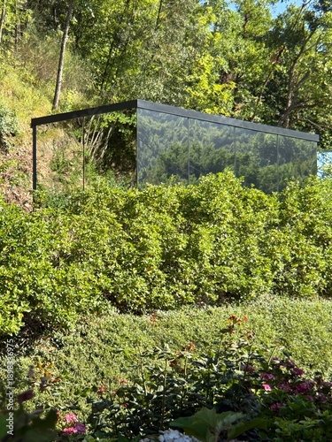 Glass-Walled Modern Structure Hidden Among Tuscan Greenery
