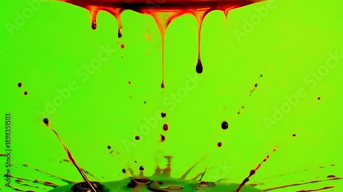 Realistic dark red blood dripping from top continuously on green screen.