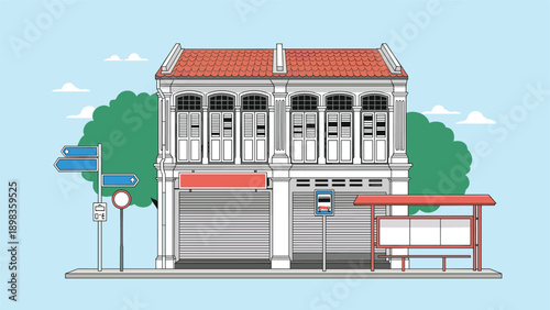 Charming two-story traditional shophouse building featuring classic architecture with a bus stop and street signage in front of it.