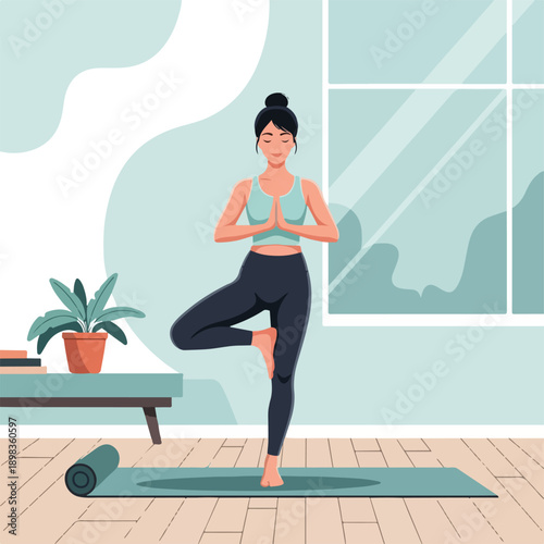A woman in a yoga pose stands on a mat in a room with a plant