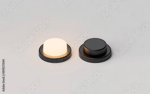 Two black and white circular objects on a gray surface
