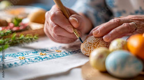Grandfather and granddaughter painting Easter eggs together