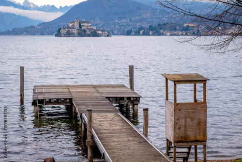Tableau sur toile Winter view of Orta San Giulio island, in the Orta Lake (piedmont, Northern Italy) seen from a lake pier