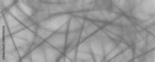 Abstract halftone background made of dense hexagonal dot patterns creating soft organic shapes and layered tonal variations on a gray surface.