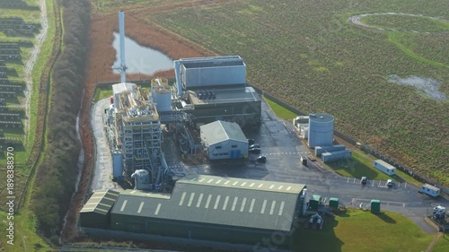 Modern bioenergy facility in Boston Lincolnshire captured by drone featuring fuel storage and stacks for sustainable green electricity generation