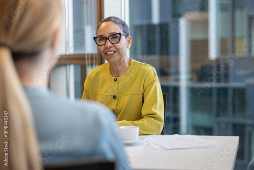 Senior businesswoman listening in a business meeting