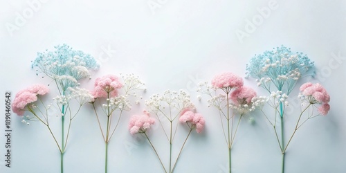Pastel Flower Arrangement Delicate Pink and Blue Blooms on a Light Background
