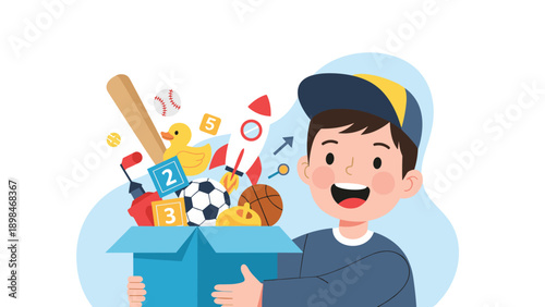 Happy young boy excitedly carries a large blue cardboard box filled with his favorite toys including sports balls and a rocket.