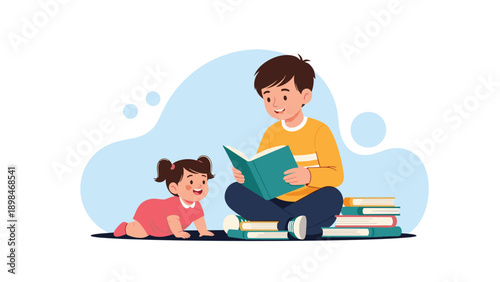 Older brother sits on the floor and reads a story from a book to his baby sister who is crawling happily towards him.