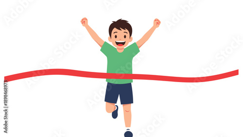 Excited young boy crossing the finish line of a running race with his arms raised in triumph and a big smile.
