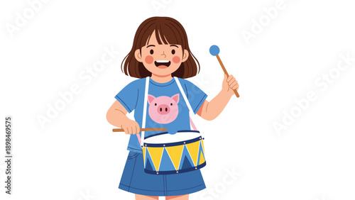 Enthusiastic young girl in a blue dress with a pig design plays a colorful drum with blue mallets and a happy smile.