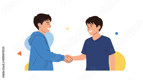 Two teenage boys shaking hands as a sign of friendship, agreement, or greeting in a casual and friendly outdoor setting.