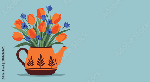 Vibrant bouquet of orange tulips and blue cornflowers arranged in a decorative orange teapot against a light blue backdrop.