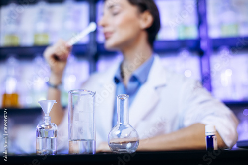 Female perfumer crating perfumes at her laboratory