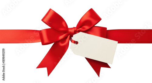 Festive red ribbon bow with a blank tag, ideal for holiday gift announcements