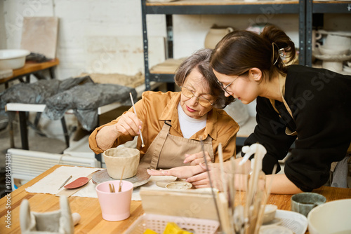 Sweet old lady is engaged in creativity in the workshop