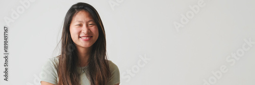 Photos Young woman smiling looking at camera and smiling, isolated on white background, studio shot