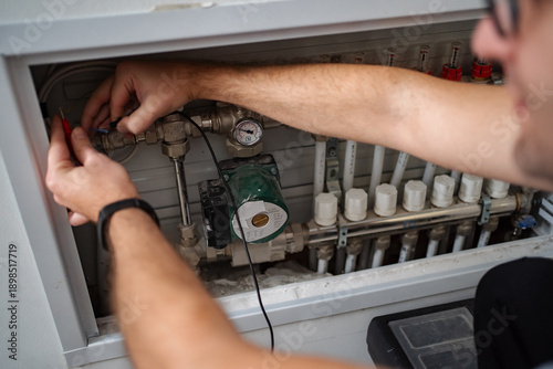 Fotografie Technician working on home heating system maintenance