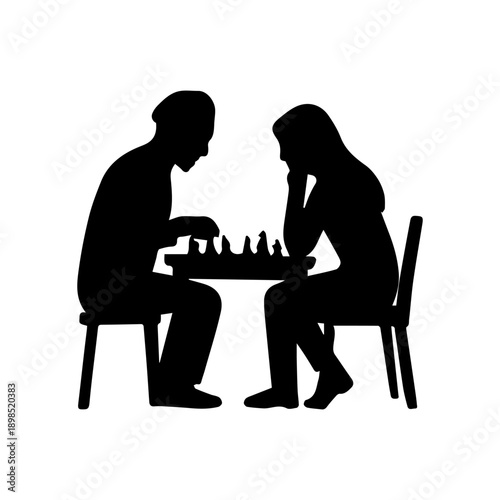 Two people  man and woman in silhouette playing a game of chess
