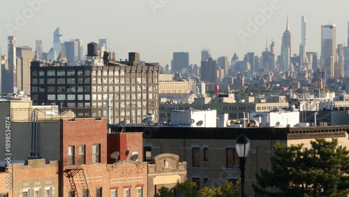 New York City Manhattan skyline from Brooklyn Sunset Park, United States of America. Urban cityscape with skyscraper buildings from residential district near Park slope and Greenwood Heights.