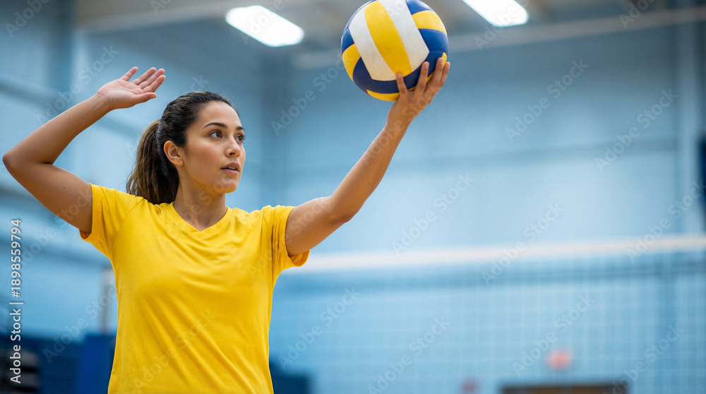 custom made wallpaper toronto digitalYoung female volleyball player in yellow t-shirt holding ball. Athlete preparing to serve in indoor gymnasium. Sports and fitness concept
