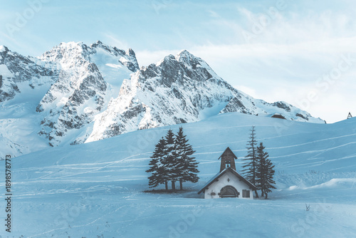 Obraz na płótnie alpine chapel in a snow covered landscape at col de lautaret in french alps