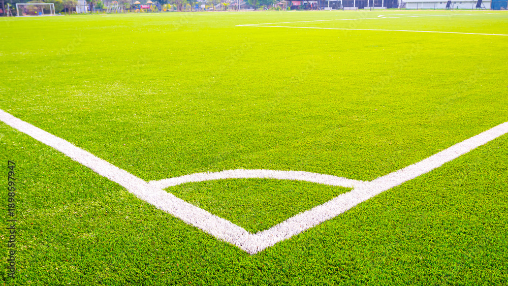 Obraz premium Close up of corner kick line on a professional green artificial turf soccer football field
