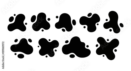 Set of black ink blot shapes isolated on a white background.