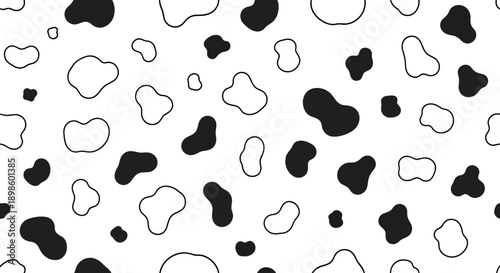 Seamless black and white cow print pattern with organic shapes.