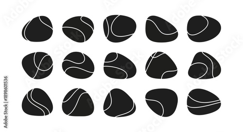 Set of smooth black river stones with white lines, natural rock collection.