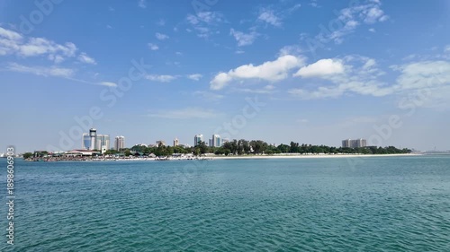 Dar Es Salaam, Tanzania: Footage of ferry leaving harbor in coastline of in Dar Es Salaam toward zanzibar in Tanzania in the Indian ocean on a sunny day.