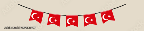 Turkish Flag Bunting Garland Hanging on a String as a Festive Decoration for a National Holiday or Patriotic Celebration.