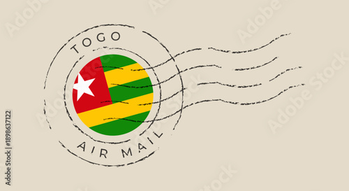 Togo flag within a vintage air mail postal stamp with a grunge cancellation mark on a retro envelope.