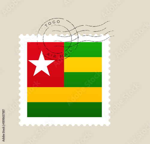 Togo national flag on a postage stamp with an air mail postmark cancellation for international travel correspondence.