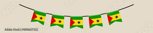 São Tomé and Príncipe flag bunting hanging on a string for a national holiday or festival celebration.