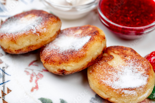 Traditional Russian Syrniki (Cottage Cheese Pancakes) with Powdered Sugar