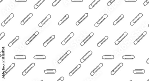 Seamless monochrome pattern consisting of scattered paper clips in a clean and organized arrangement for office and school themes.