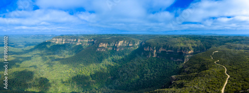 Drone aerial panoramic photograph of the Jamison Valley near the town of Wentworth Falls in the Blue Mountains in New South Wales, Australia.