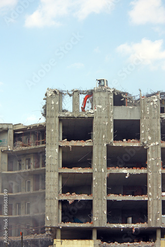 Demolition of the building with demolition excavator